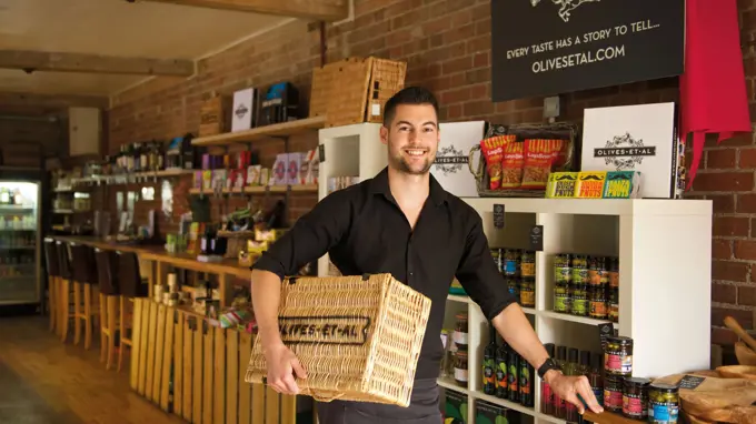 Man In Artisan Shop With Produce